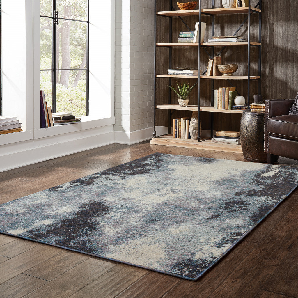 7' X 10' Blue and Ivory Abstract Power Loom Area Rug