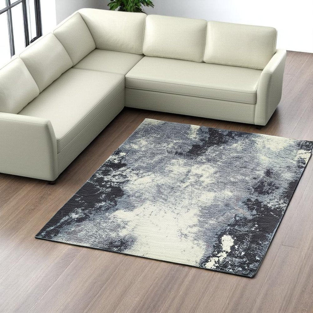 8' X 11' Blue and Ivory Abstract Power Loom Area Rug