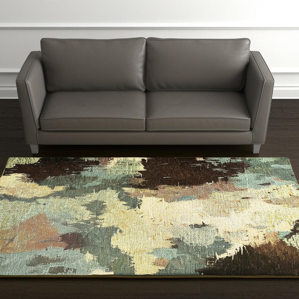 5' X 7' Blue and Ivory Abstract Power Loom Area Rug