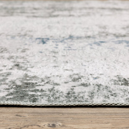 5' X 7' Silver Grey Charcoal And Light Blue Abstract Printed Stain Resistant Non Skid Area Rug