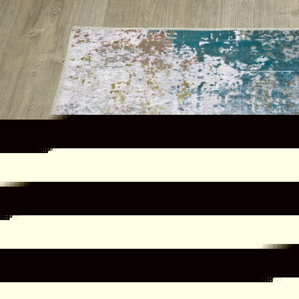 2' X 3' Ivory And Blue Abstract Printed Stain Resistant Non Skid Area Rug
