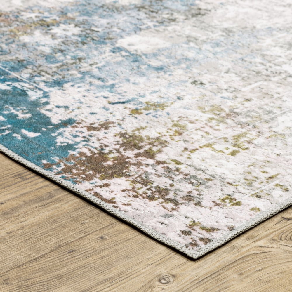 4' X 6' Ivory And Blue Abstract Printed Stain Resistant Non Skid Area Rug