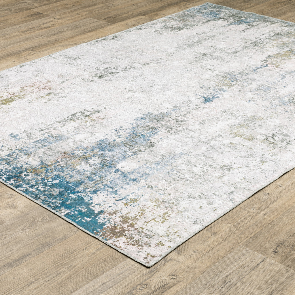 5' X 7' Ivory Teal Blue Grey Brown And Gold Abstract Printed Stain Resistant Non Skid Area Rug