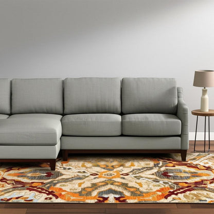 10' X 13' Beige Orange Blue Gold And Grey Abstract Power Loom Stain Resistant Area Rug