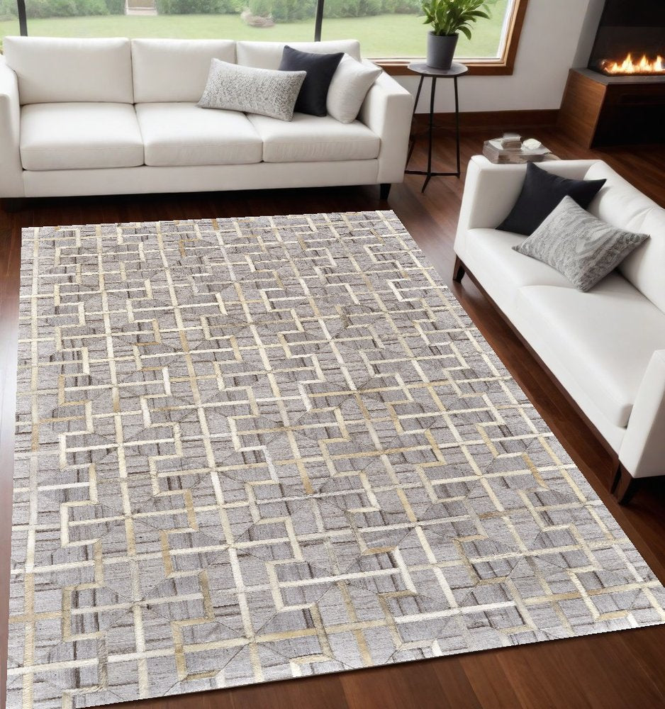 5' X 8' Tan and Brown Geometric Hand Woven Area Rug
