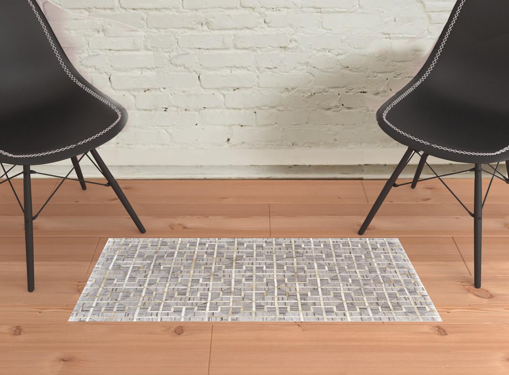 5' X 8' Tan and Brown Geometric Hand Woven Area Rug