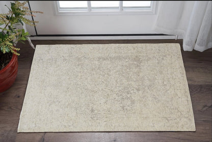 2' X 3' Ivory And Tan Abstract Hand Woven Area Rug