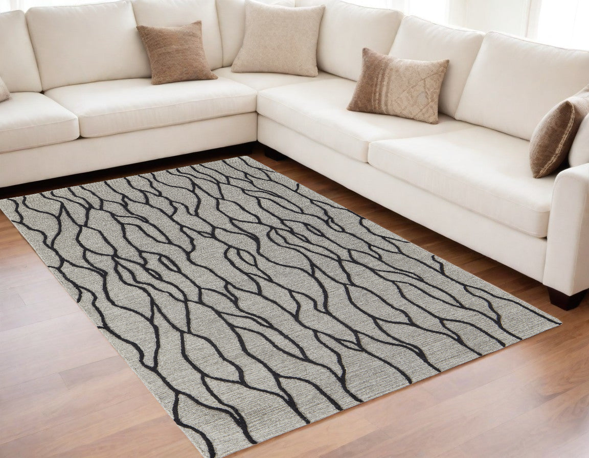 5' X 8' Taupe Black And Gray Wool Abstract Tufted Handmade Stain Resistant Area Rug