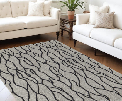 5' X 8' Taupe Black And Gray Wool Abstract Tufted Handmade Stain Resistant Area Rug