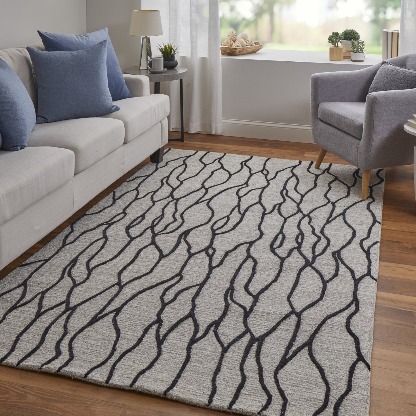 5' X 8' Taupe Black And Gray Wool Abstract Tufted Handmade Stain Resistant Area Rug