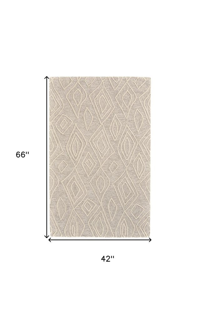 8' X 11' Tan And Ivory Wool Geometric Tufted Handmade Stain Resistant Area Rug