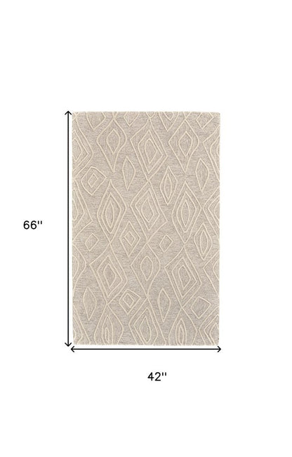 8' X 11' Tan And Ivory Wool Geometric Tufted Handmade Stain Resistant Area Rug