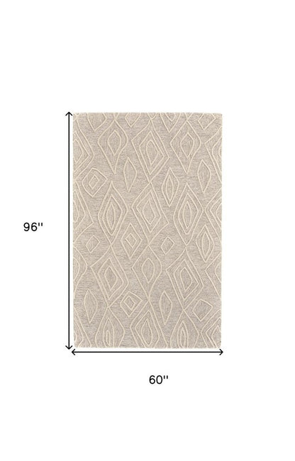 8' X 11' Tan And Ivory Wool Geometric Tufted Handmade Stain Resistant Area Rug