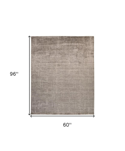 2' X 3' Gray and Ivory Abstract Hand Woven Area Rug