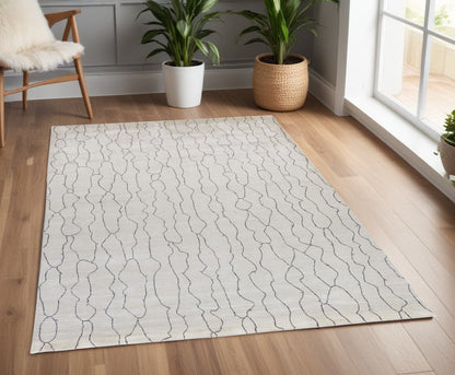 5' X 8' Ivory And Gray Abstract Hand Woven Area Rug