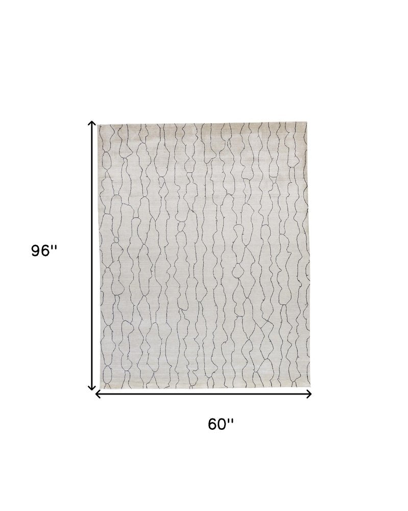 5' X 8' Ivory And Gray Abstract Hand Woven Area Rug