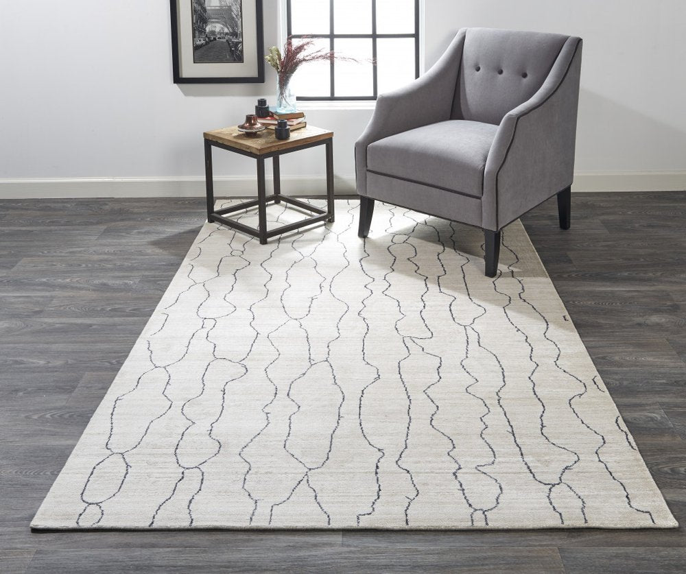 5' X 8' Ivory And Gray Abstract Hand Woven Area Rug