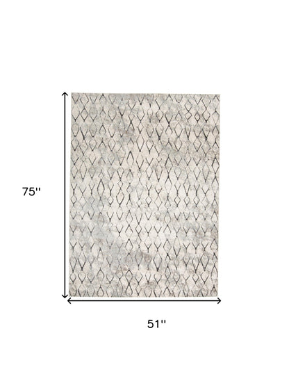 5' X 8' Ivory Gray And Taupe Abstract Stain Resistant Area Rug