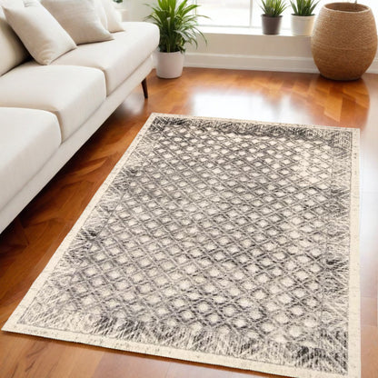 5' X 8' Ivory Black And Taupe Abstract Stain Resistant Area Rug