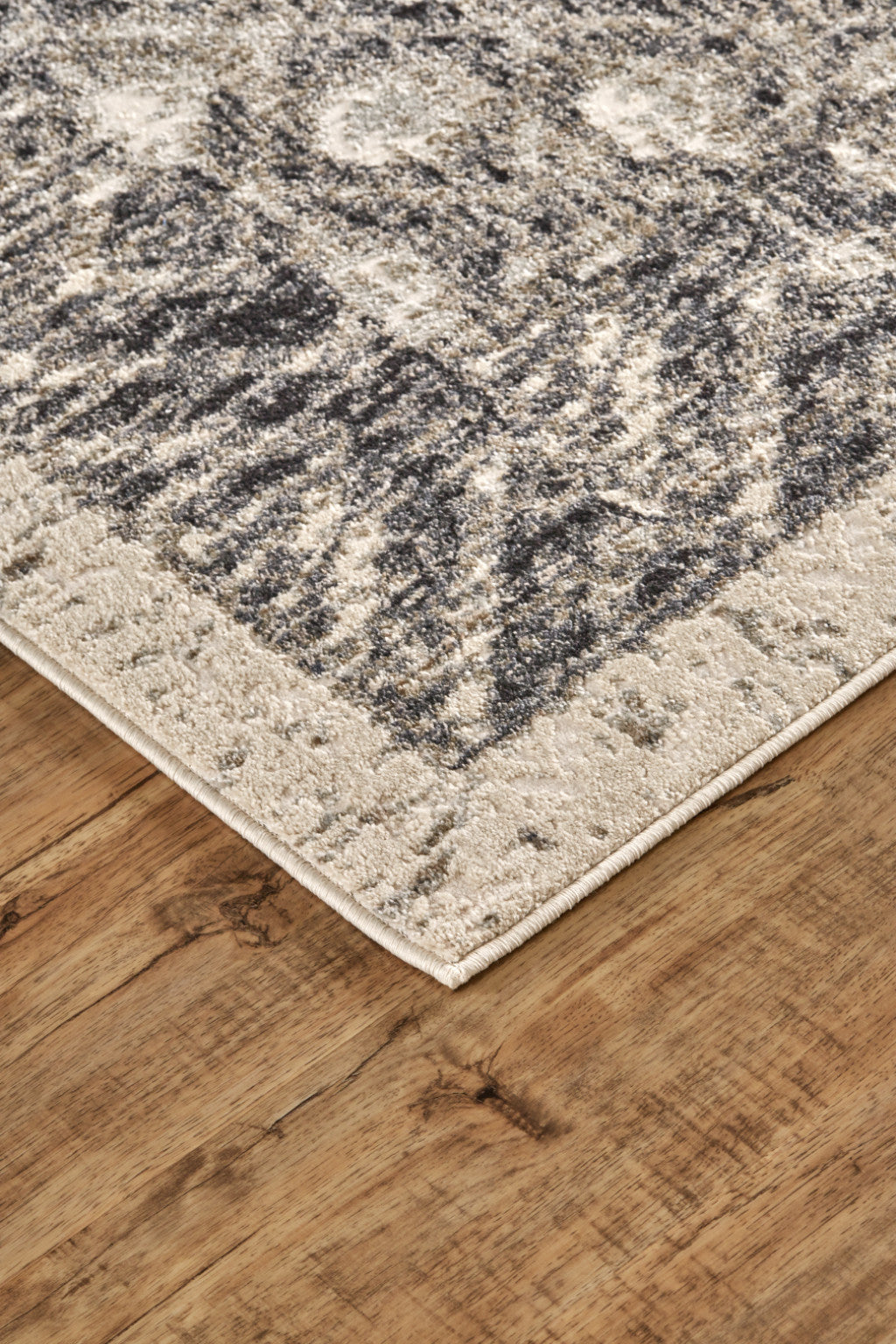 5' X 8' Ivory Black And Taupe Abstract Stain Resistant Area Rug