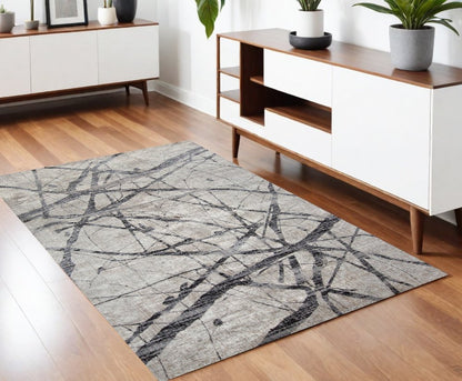 5' X 8' Taupe Gray And Ivory Abstract Stain Resistant Area Rug