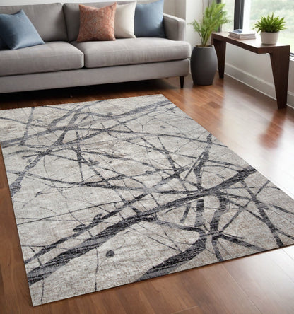 4' X 6' Taupe Gray And Ivory Abstract Stain Resistant Area Rug