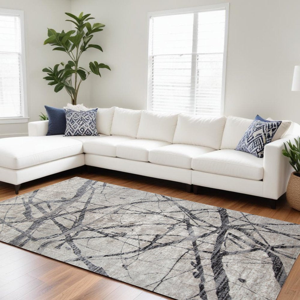 5' X 8' Taupe Gray And Ivory Abstract Stain Resistant Area Rug