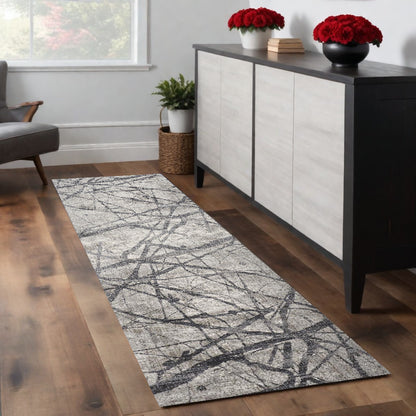 4' X 6' Taupe Gray And Ivory Abstract Stain Resistant Area Rug