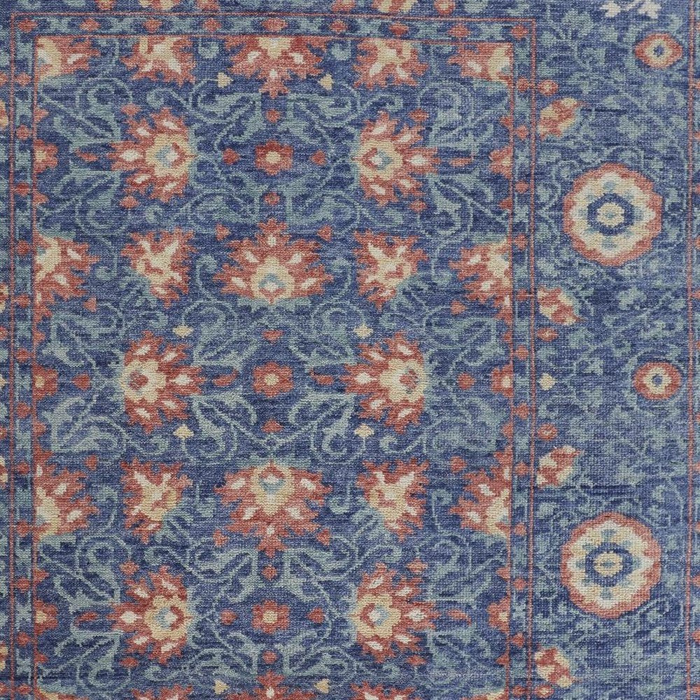 8' X 10' Blue And Red Wool Floral Hand Knotted Stain Resistant Area Rug