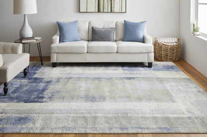 9' X 12' Blue Green And Ivory Abstract Power Loom Distressed Area Rug