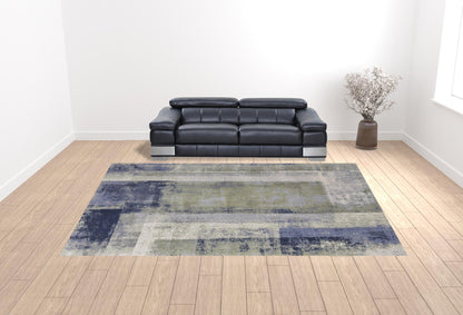 9' X 12' Blue Green And Ivory Abstract Power Loom Distressed Area Rug