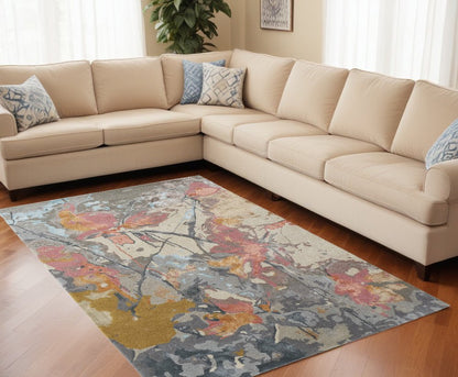 5' X 8' Ivory and Blue Wool Floral Hand Tufted Area Rug