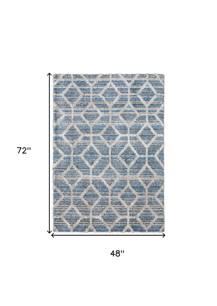 5' X 8' Tan Taupe And Ivory Geometric Power Loom Stain Resistant Area Rug