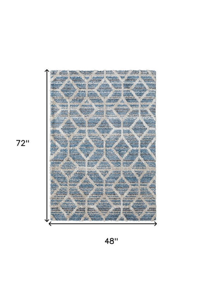 5' X 8' Tan Taupe And Ivory Geometric Power Loom Stain Resistant Area Rug