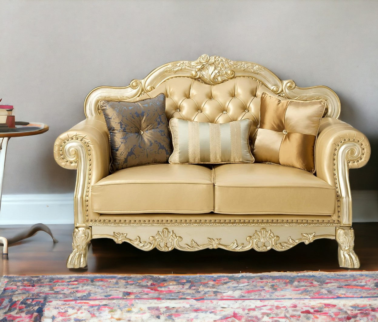 64" Bone And Gold Faux Leather Loveseat and Toss Pillows