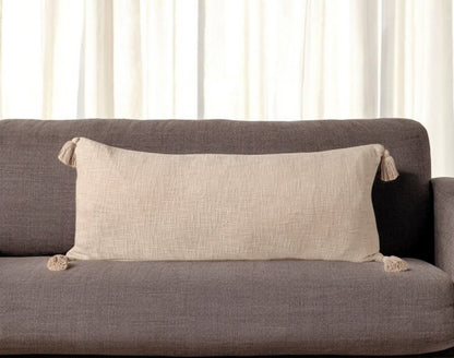 14" X 36" Beige Cotton Throw Pillow with Tassels