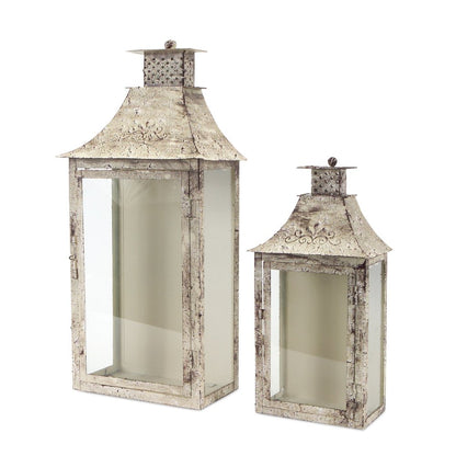 Set of Two Beige Distressed Filigree Iron And Glass Floor Lantern Candle Holders