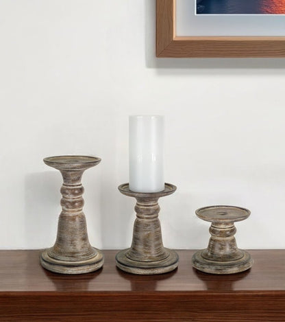 Set of Three Brown Distressed Stone Tabletop Taper Candlesticks