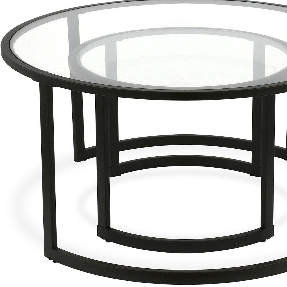 Set of Two Black Glass And Steel Round Sled Nested Coffee Tables