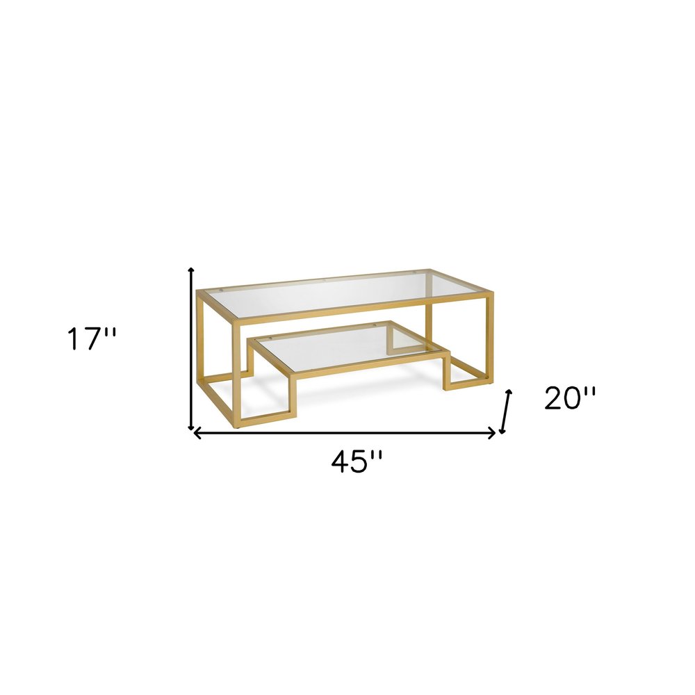 45" Clear And Gold Glass And Steel Sled Coffee Table With Shelf