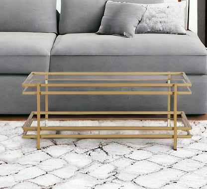 45" Gold Glass And Steel Coffee Table With Shelf