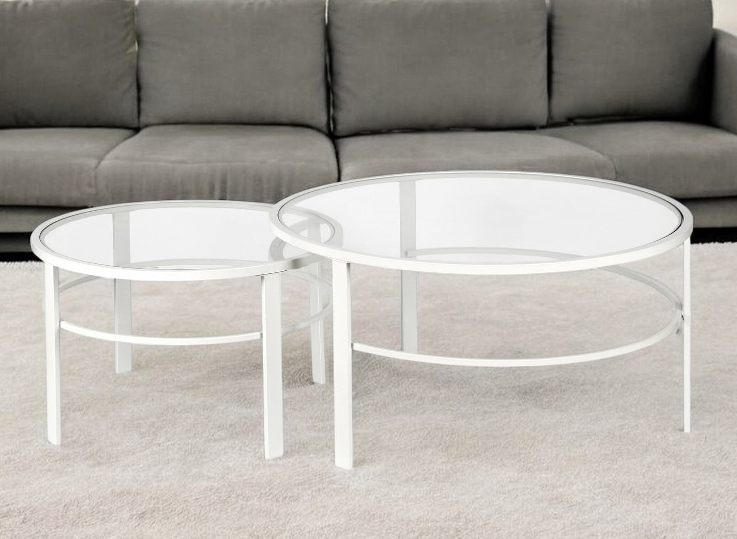 Set of Two 36" White Glass And Steel Round Nested Coffee Tables