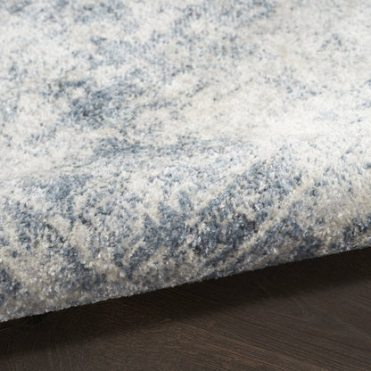 9' X 12' Blue and Ivory Oriental Power Loom Distressed Area Rug