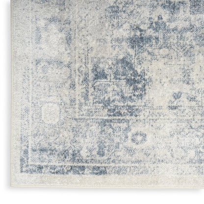 9' X 12' Blue and Ivory Oriental Power Loom Distressed Area Rug