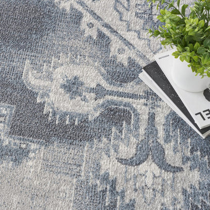 9' X 12' Blue and Ivory Oriental Power Loom Distressed Area Rug