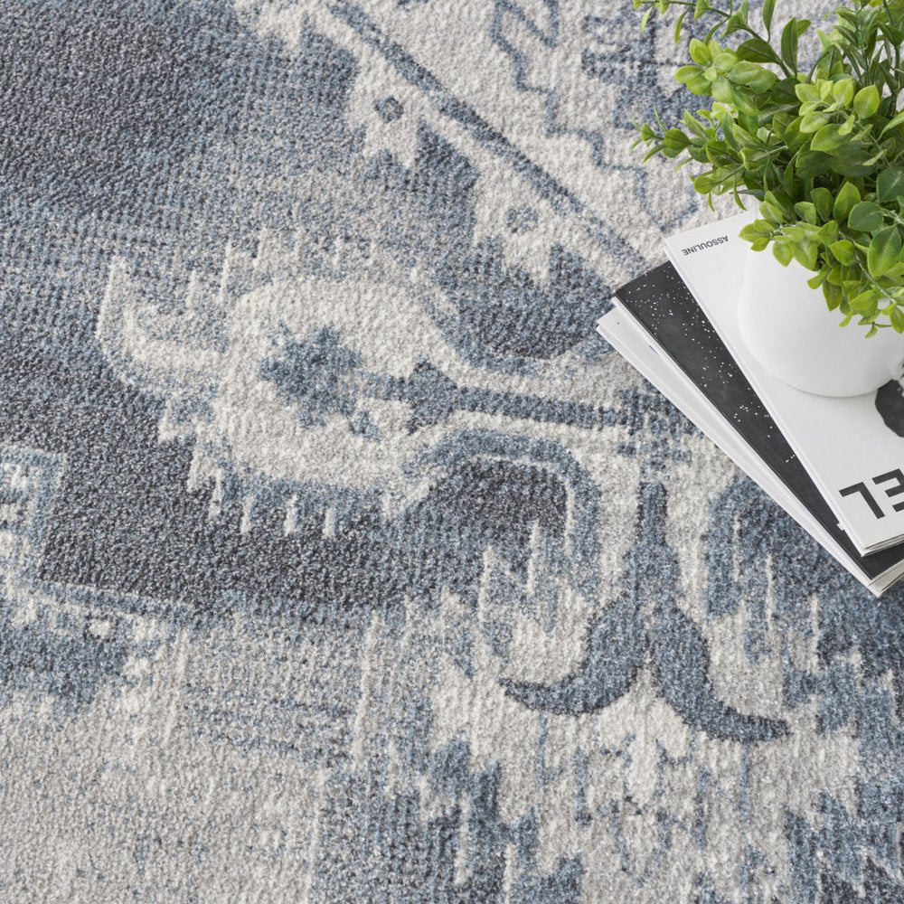 9' X 12' Blue and Ivory Oriental Power Loom Distressed Area Rug