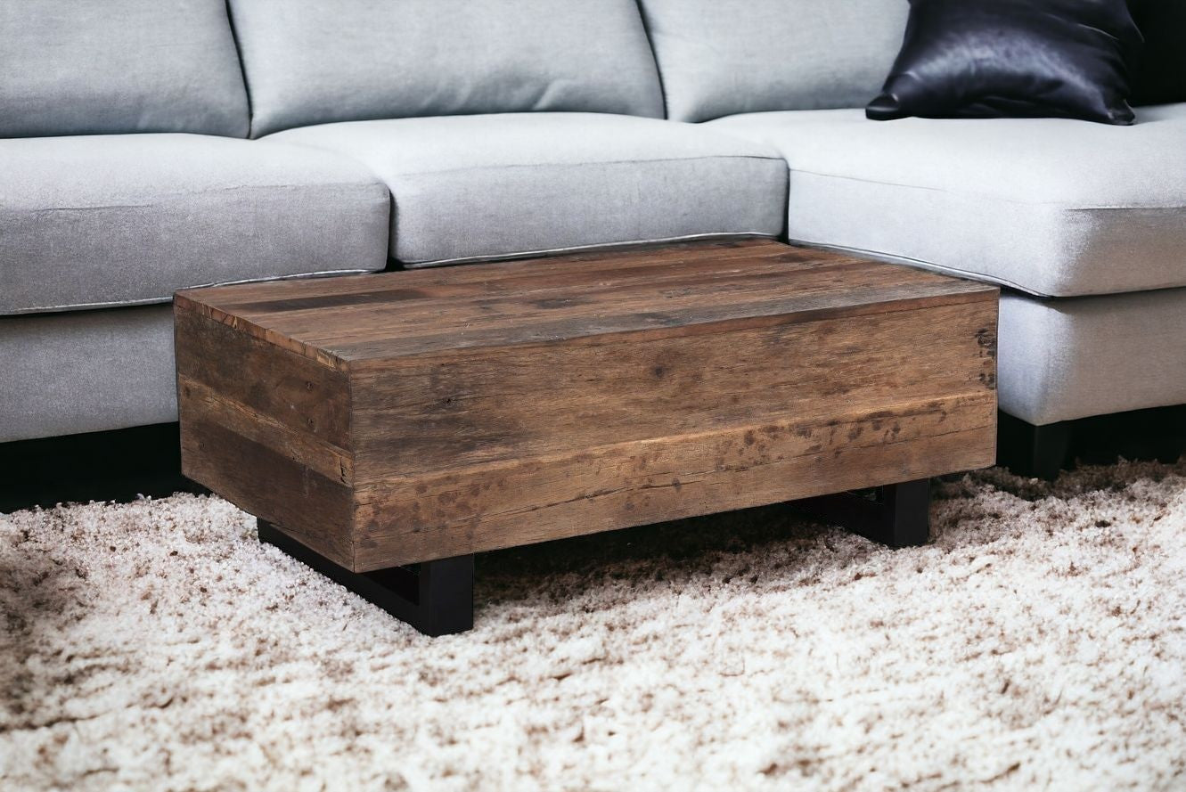 52" Dark Brown And Black Solid Wood And Metal Distressed Coffee Table