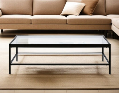 54" Clear And Black Glass And Steel Coffee Table With Shelf