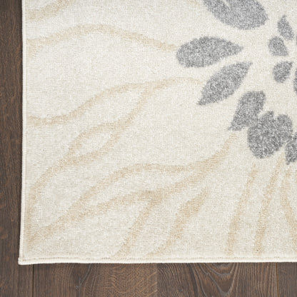 5' X 7' Cream Floral Power Loom Distressed Area Rug