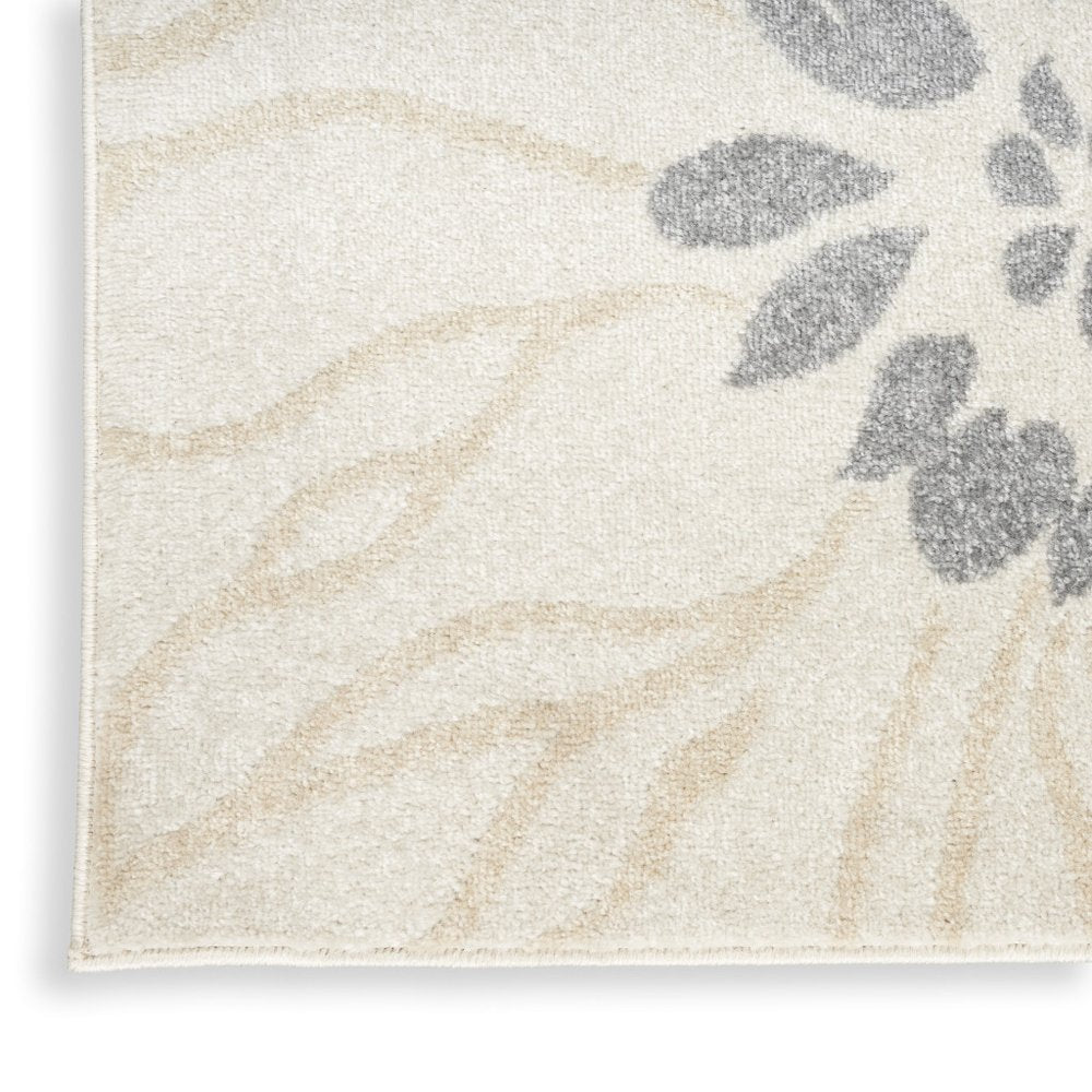 5' X 7' Cream Floral Power Loom Distressed Area Rug